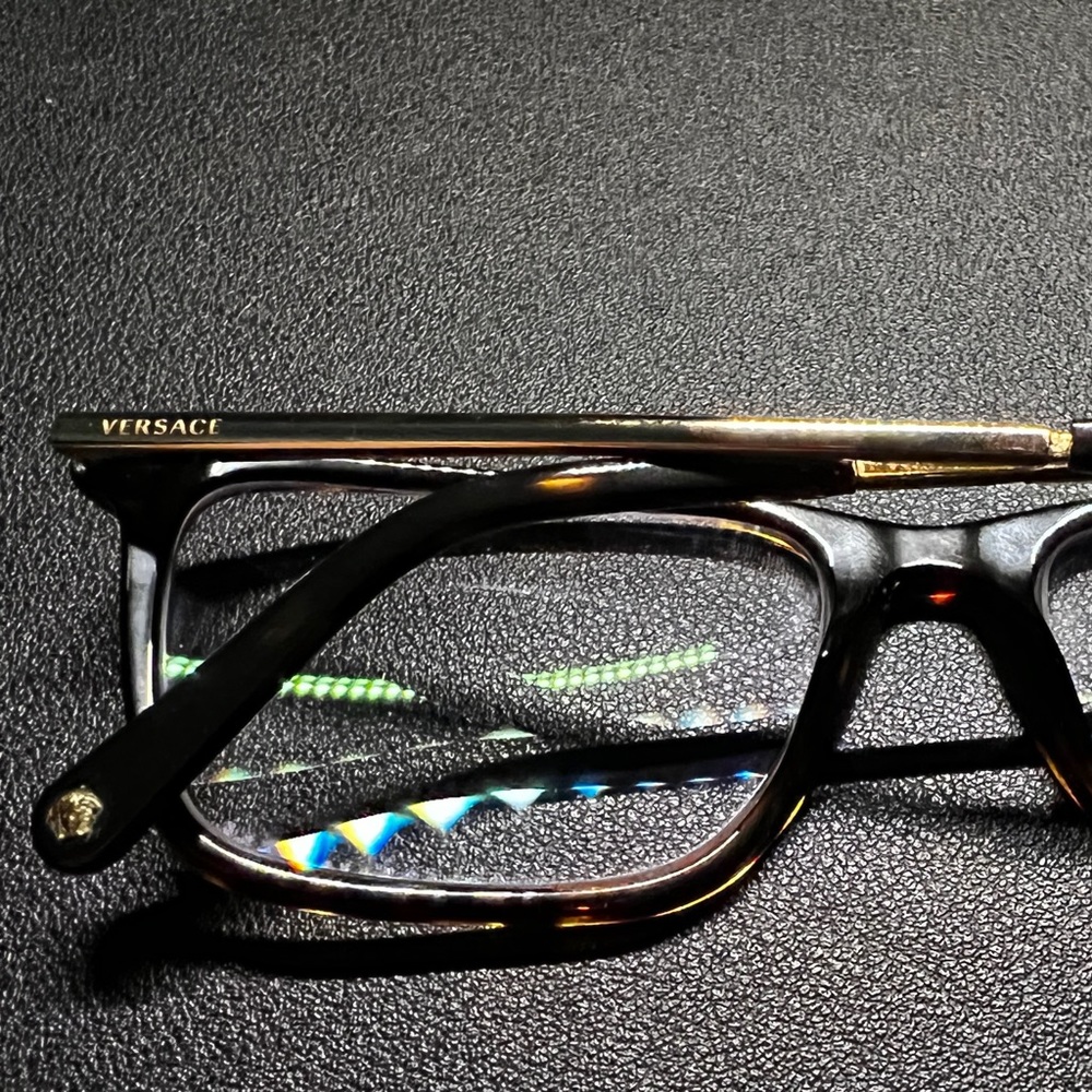 Versace men’s eyeglasses, Tortoise dark brown frames with gold temples and tips.
